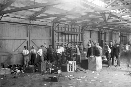 Packing & apportioning stores; Queen's Wharf, Hobart, 1911, by Frank Hurley  