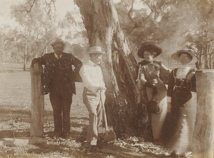 Photographs of Edmund Milne standing next to Aboriginal Arborglyphs [carved trees], Gamboola, near Molong