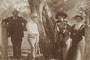 Photographs of Edmund Milne standing next to Aboriginal Arborglyphs [carved trees], Gamboola, near Molong