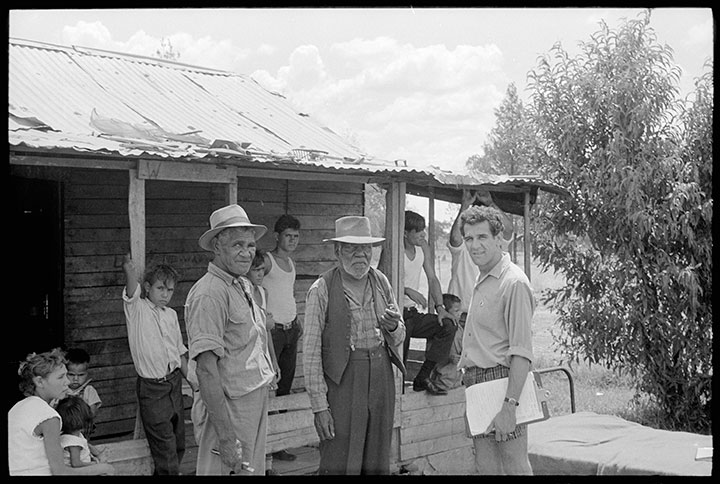 Freedom rider Charles Perkins (right) surveying members of the Moree community about living conditions