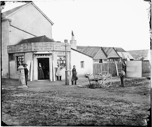 James Jaye, tinsmith and tank maker, his wife and employees outside his works, George Street, Bathurst