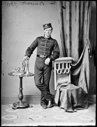 Mr [Samuel?] Buckett in bandsman's uniform and with trumpet