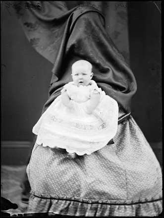 Baby Grotefent (either Alica Mary born 1872, or, William Henry born 1874) held by mother Jane Grotefent (behind curtain)