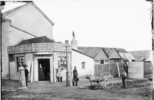 James Jaye, tinsmith and tank maker, his wife and employees outside his works, George Street, Bathurst