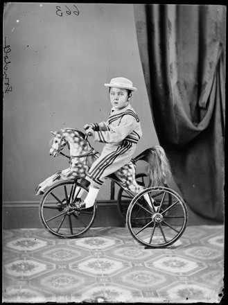 August [Augustus?] Gondolf on his tricycle