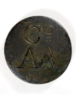 Brass button, c.1835, said to be from the uniform of an Australian Agricultural Co. convict servant, found in Newcastle.  