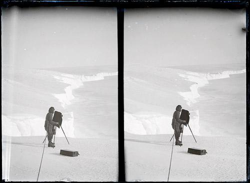 Frank Hurley photographing on the brink of the Great Ice Wall,1911 - 1914, by Frank Hurley   