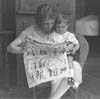 Woman and child reading newspapers