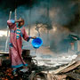 Man rinses soot from his face after gas pipeline explosion, Lagos, Nigeria, 26 December