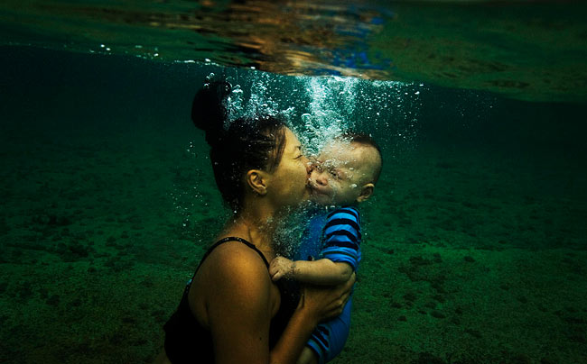 Julie Mullen from Annandale with her 10 month year old son Hendrix swimming in Mahon Pool in Maroubra
