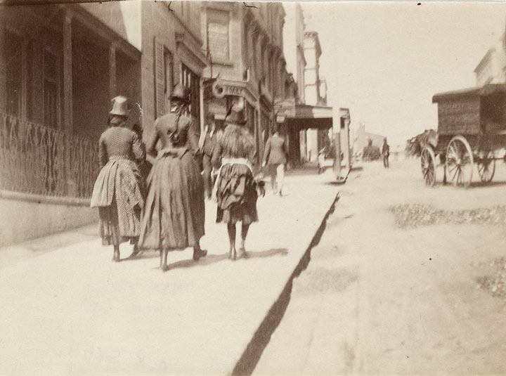 Three girls walking up William Street near McElhone Street, Kings Cross