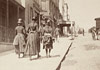 Three girls walking up William Street near McElhone Street, Kings Cross